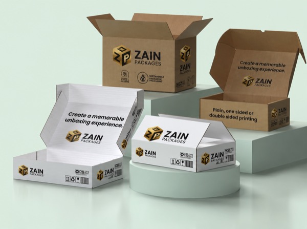 Printed kraft and white Zain Packages cartons and mailer boxes on a studio plinth